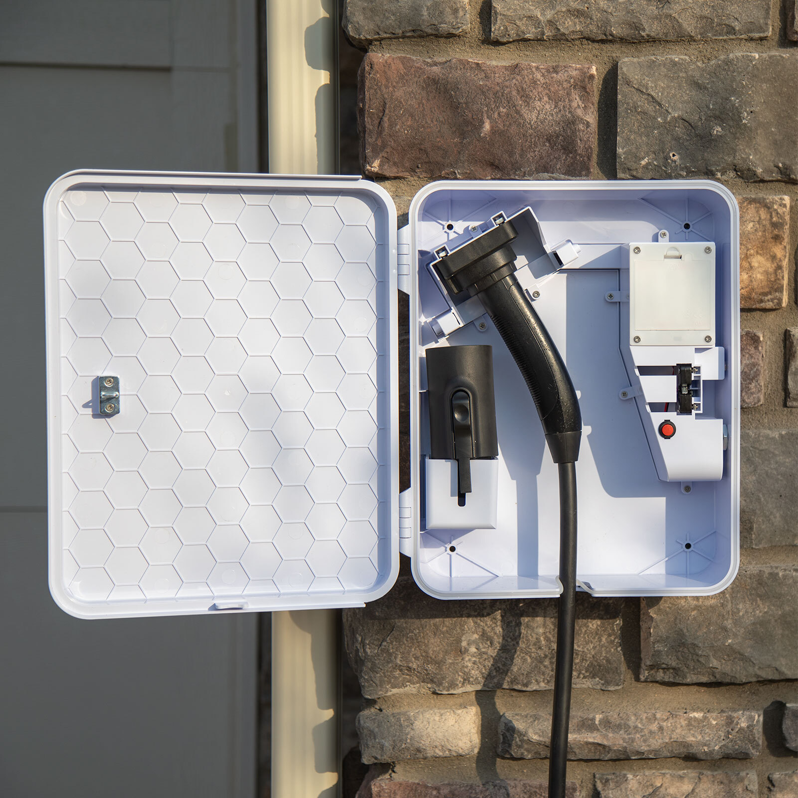 EVchargeME SmartBox mounted beside a Level 2 charger